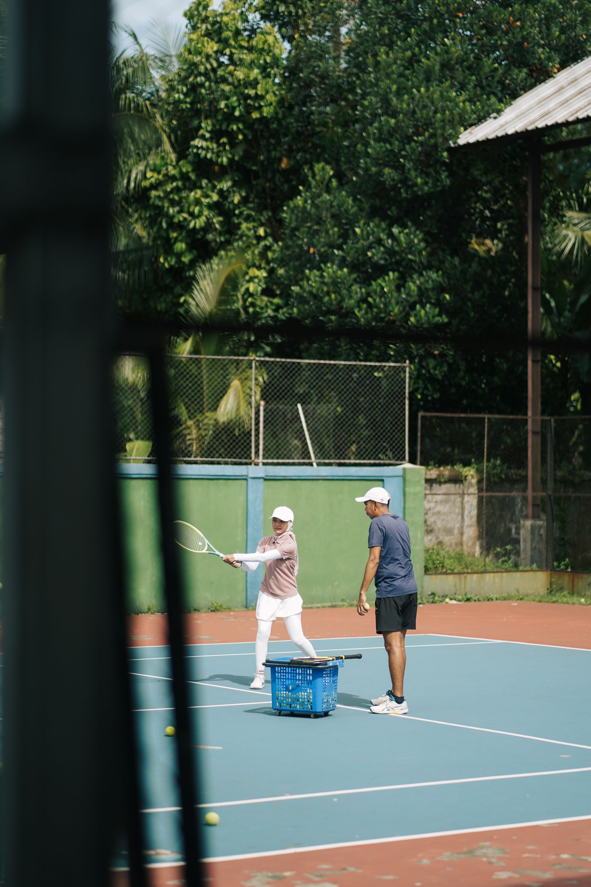 Tennisbaan met lesfoto